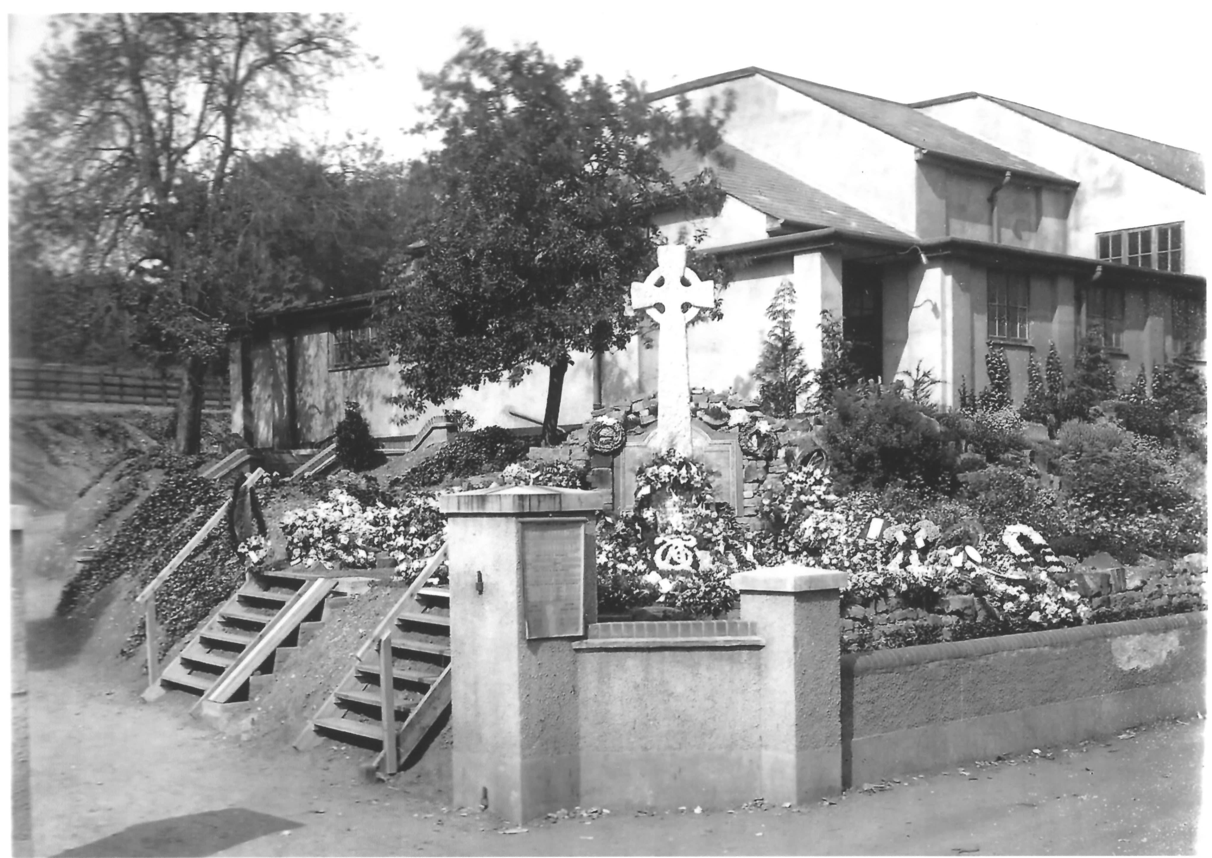 A black and white photograph of the Apsley War Memorial with surrounding garden.